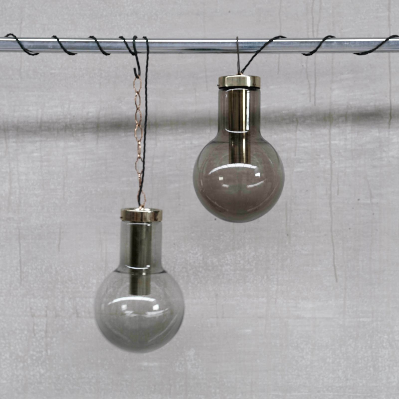 photo for sale Large Smoked Mid Century Glass And Brass Pendant Lights By Raak (2 Available)
