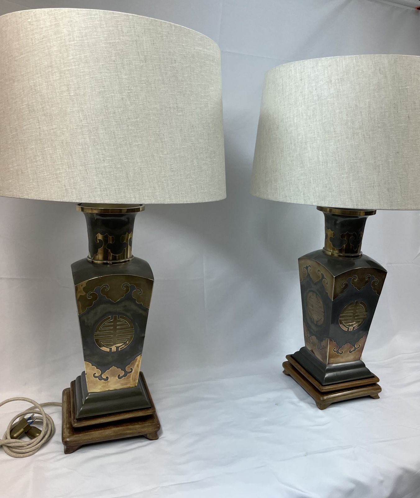 Pair Of Metal Lamps With Brass Applications On Wooden Bases.  50's photo for sale