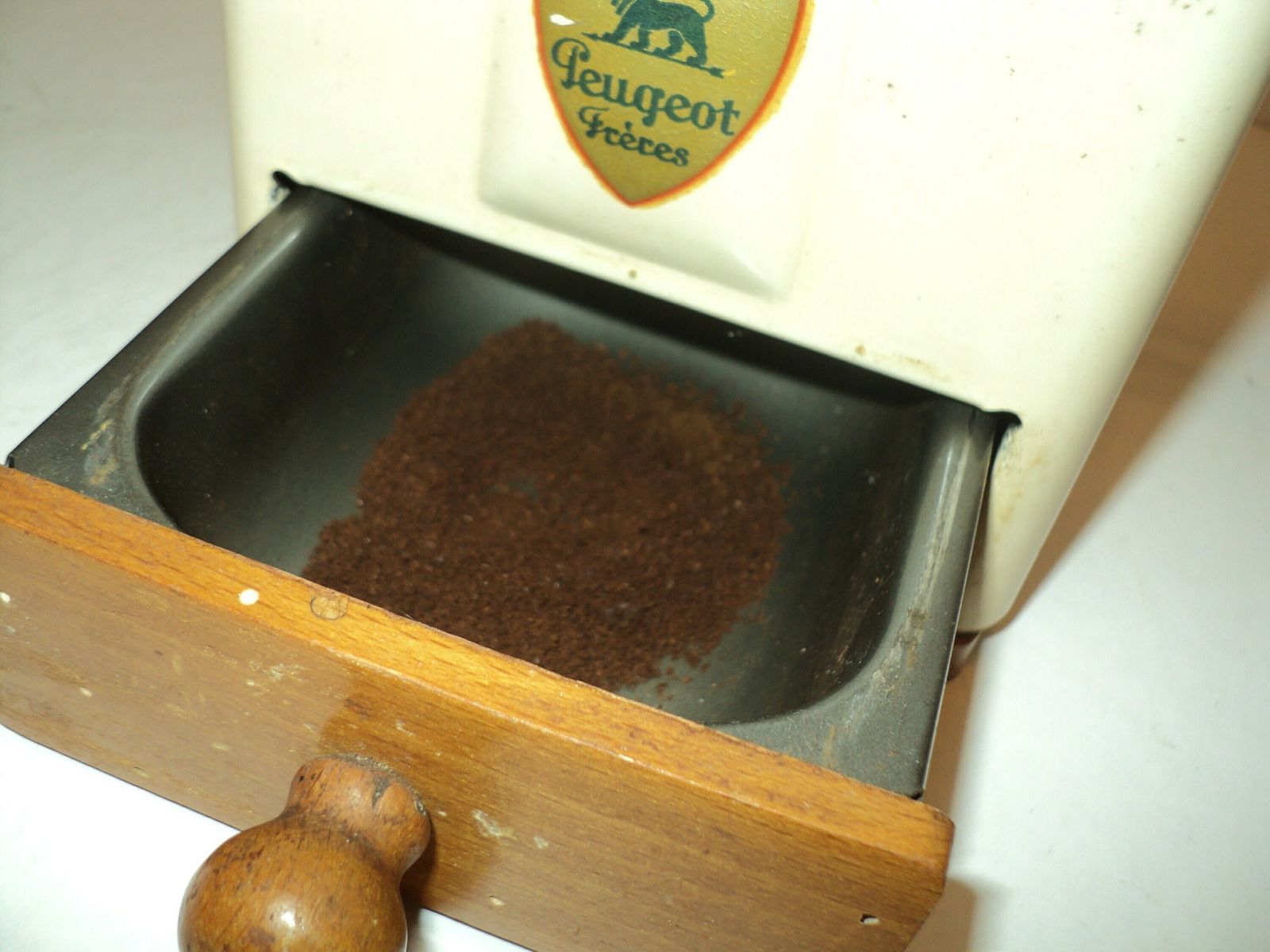 photo furniture Antique French Peugot Freres Mechanical Coffee Grinder, Cream Metal Lid And Sides, Hand Made Wood Case With Drawer