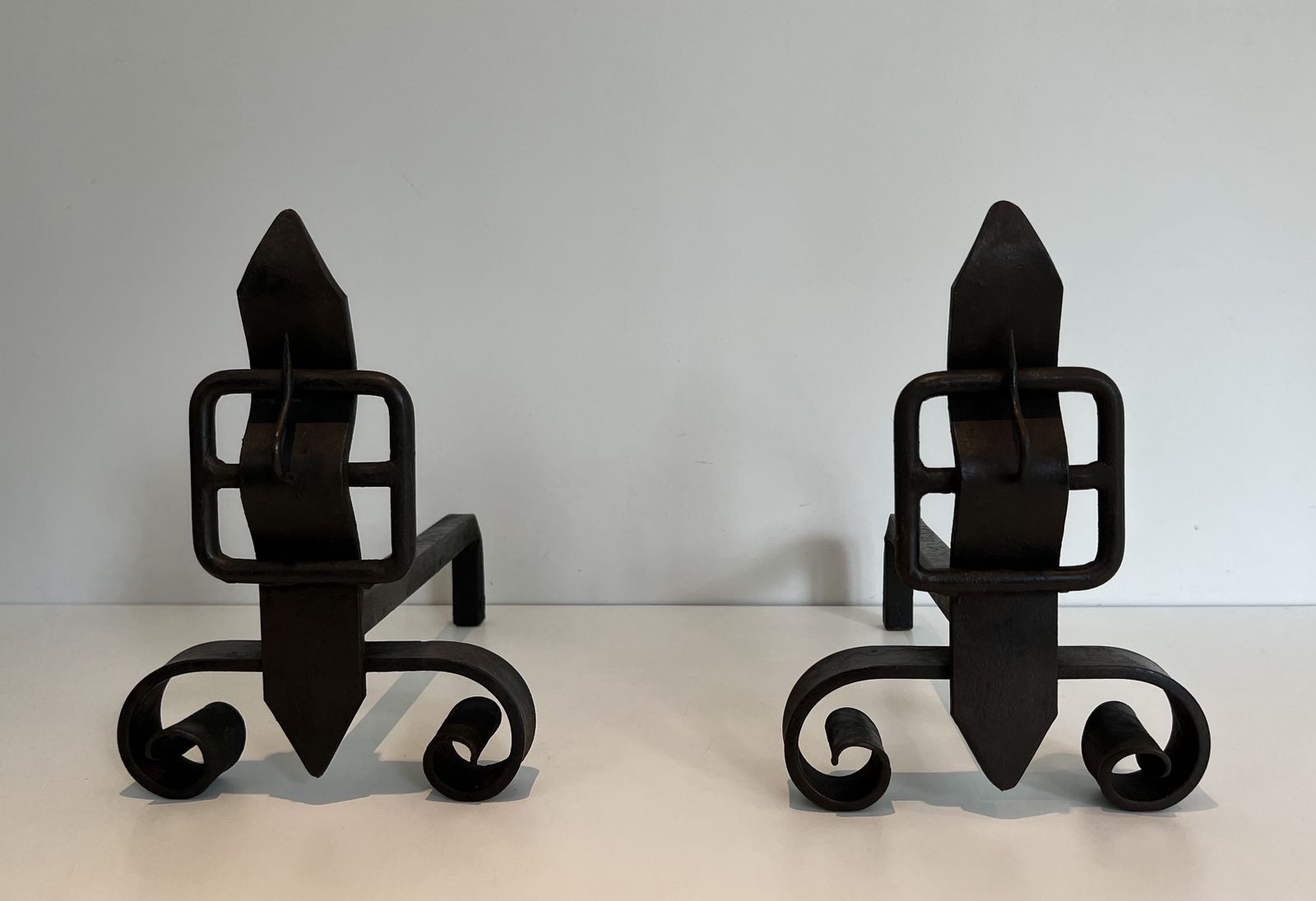 Pair Of Modernist Cast Iron And Wrought Iron Belt Andirons