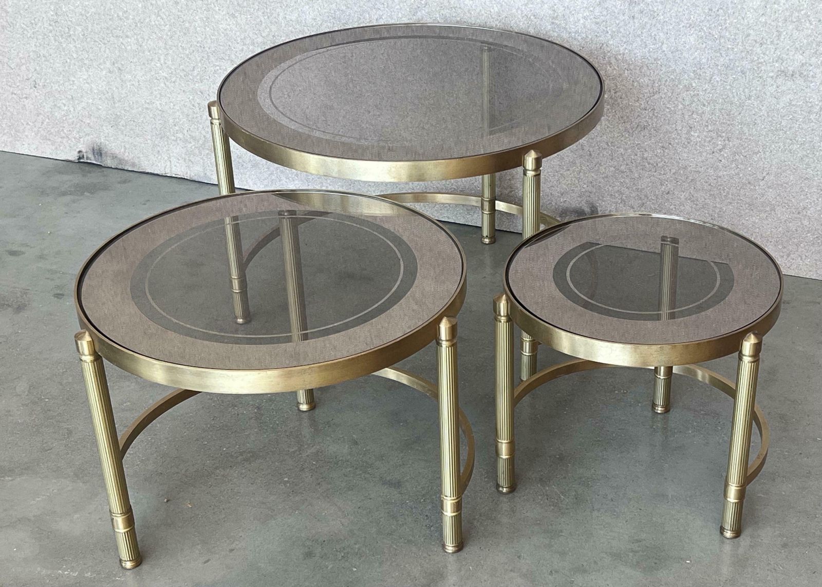 Set Of Three Round Brass Nesting Tables With Smoked Pink Glass Tops photo vinterior