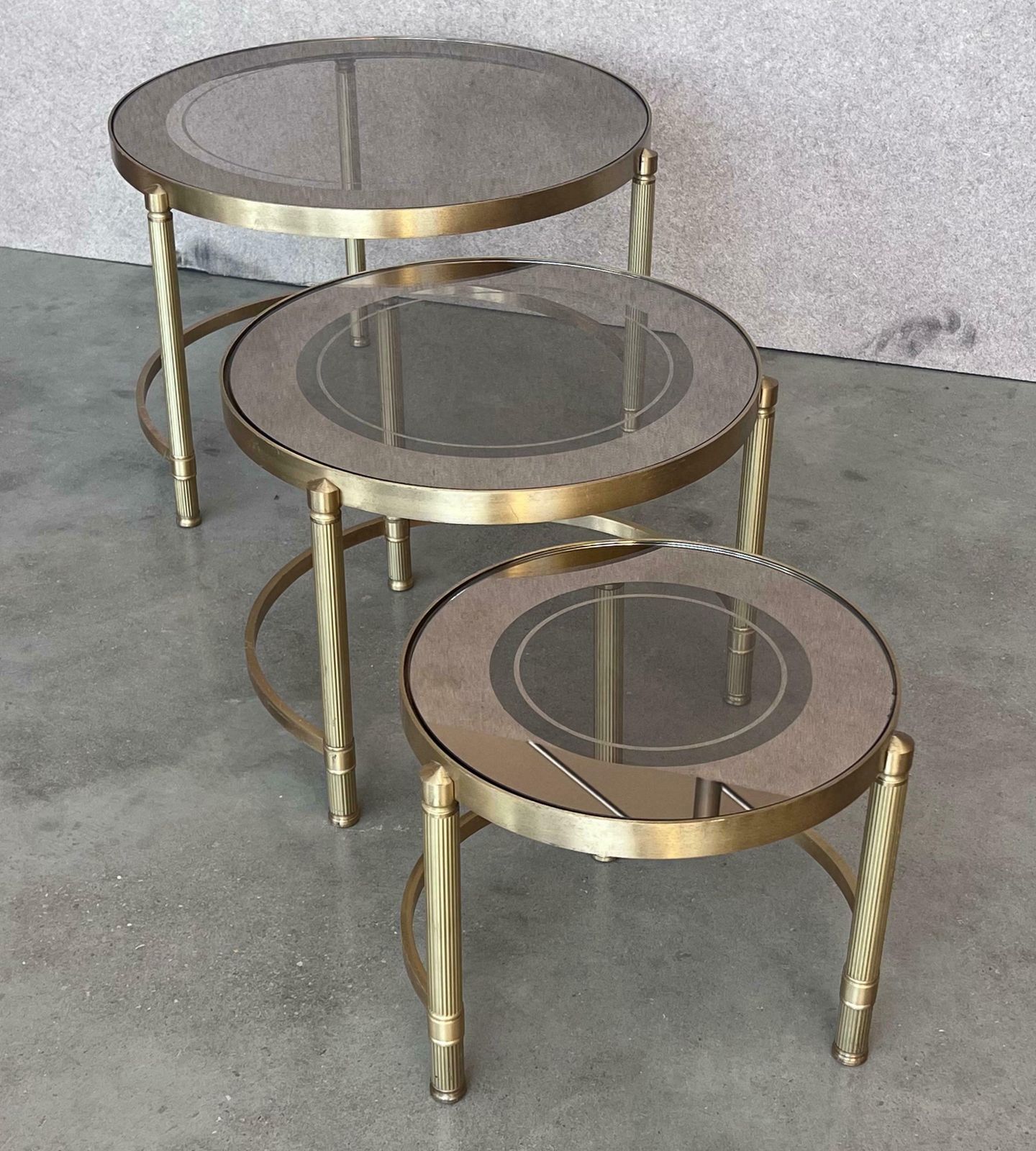 Set Of Three Round Brass Nesting Tables With Smoked Pink Glass Tops photo vintage