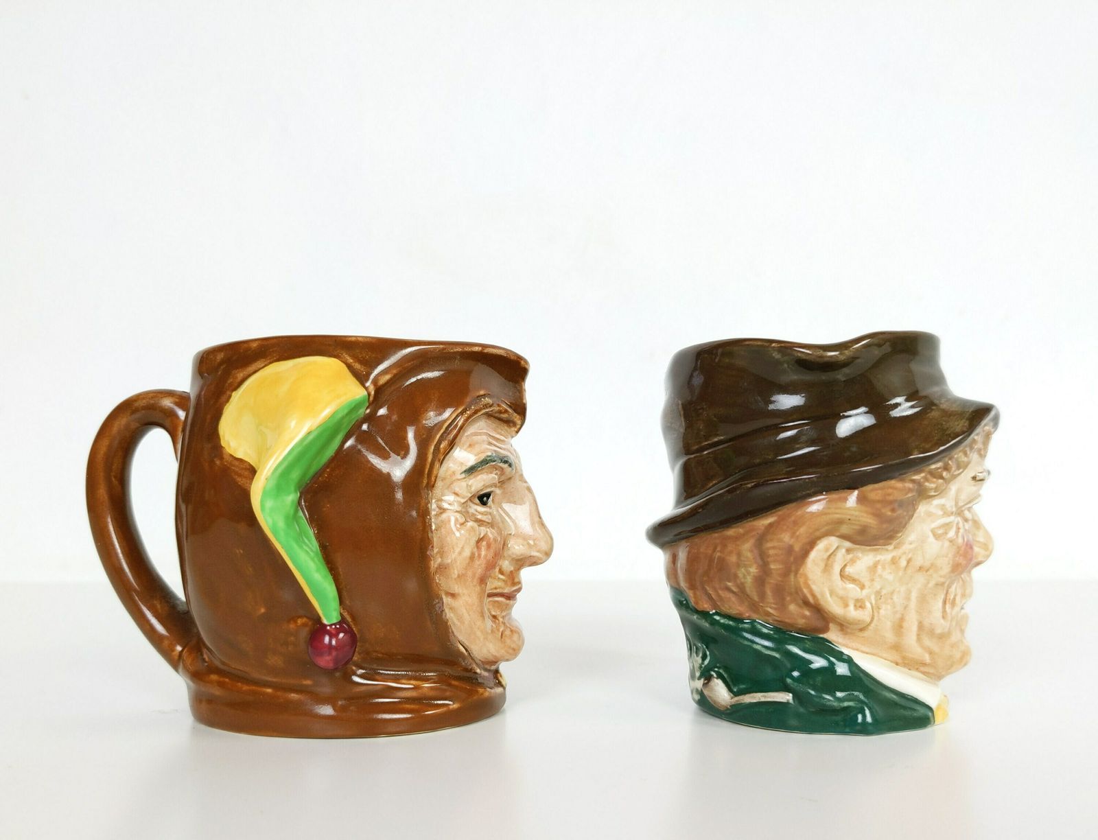 Pair Of British Royal Doulton Pottery Toby Character Jugs Of A Jester And Paddy Made In England With Vintage Makers Stamps photo for sale