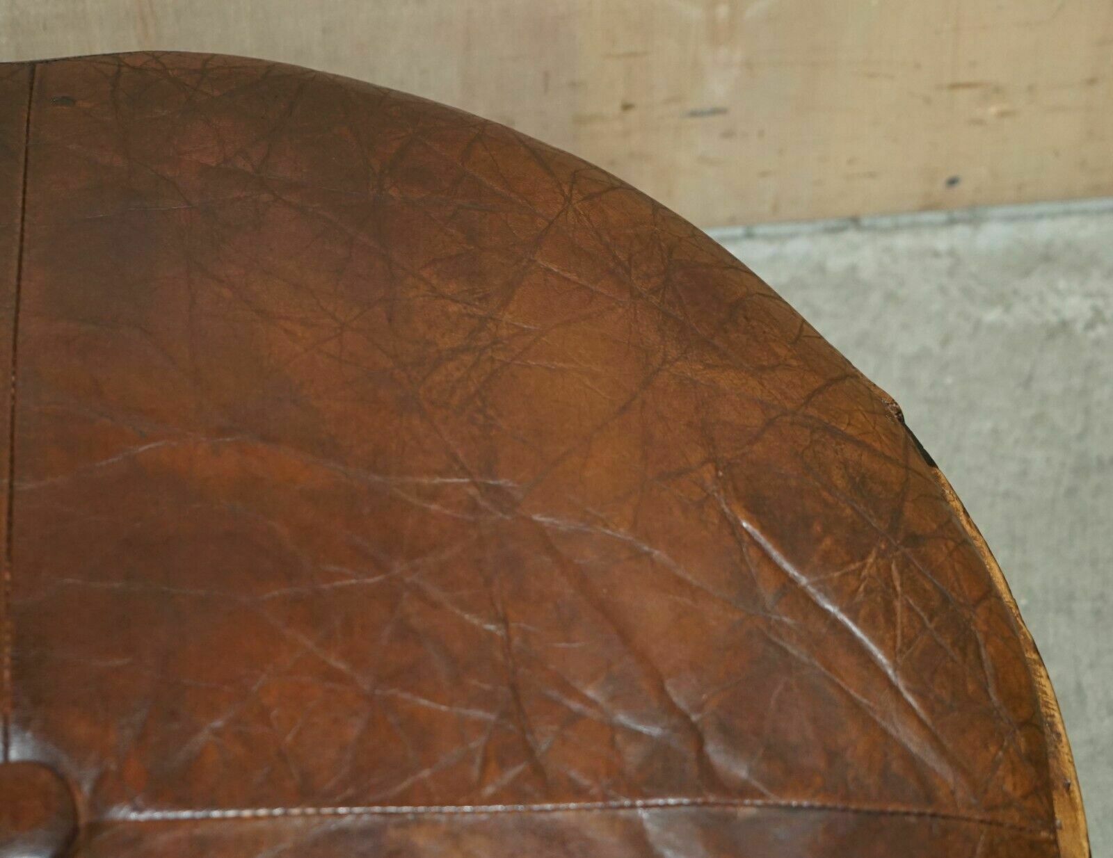 photo for sale Antique Circa 1850 Hand Carved Brown Leather Olive Press Coverted To Footstool