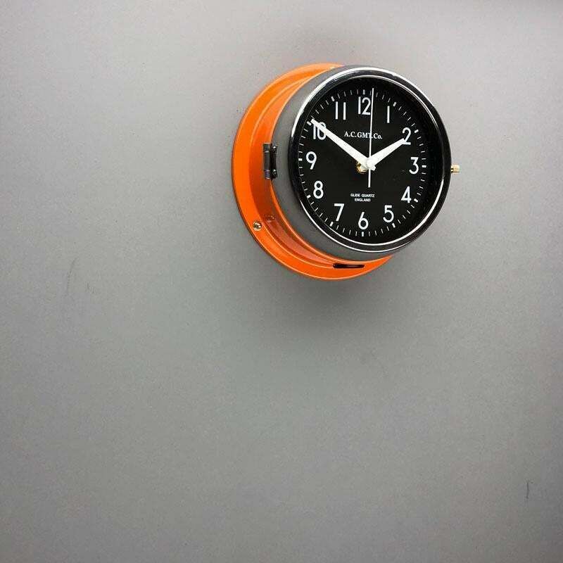photo vintage 1970s British Orange & Chrome Ac Gmt Co. Industrial Wall Clock Black Dial