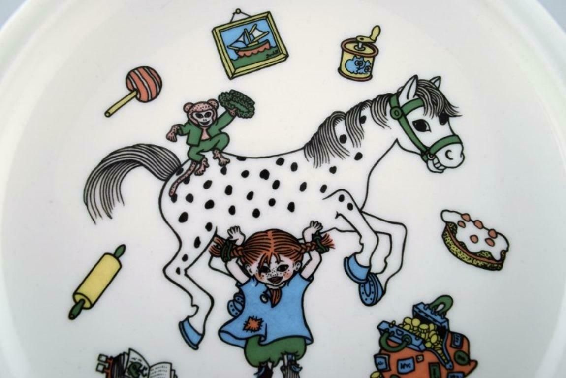 Rörstrand, Four Cups And A Plate In Porcelain With Pippi Longstocking Motifs photo for sale