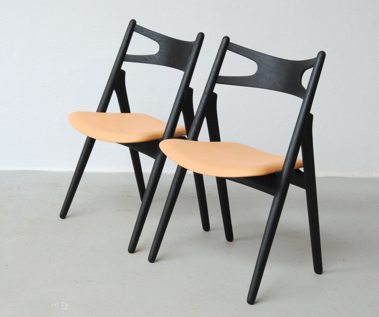 Set Of Two Fully Restored Danish Hans Wegner Sawbuck Chairs In Ebonized Oak 1950's photo furniture