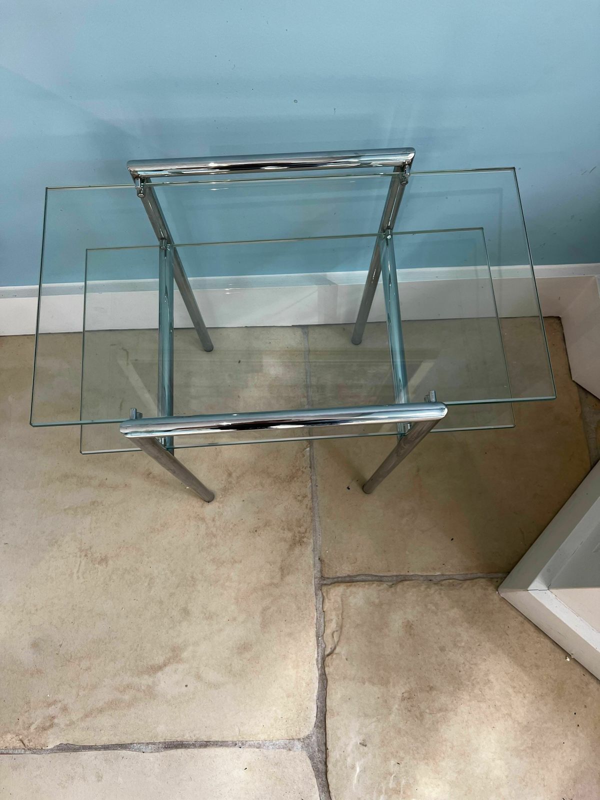 A Set Of Five Contemporary Glass And Chrome Tables. One Round Coffee Table, Four Side Tables Of Two Different Sizes. photo 1300.0
