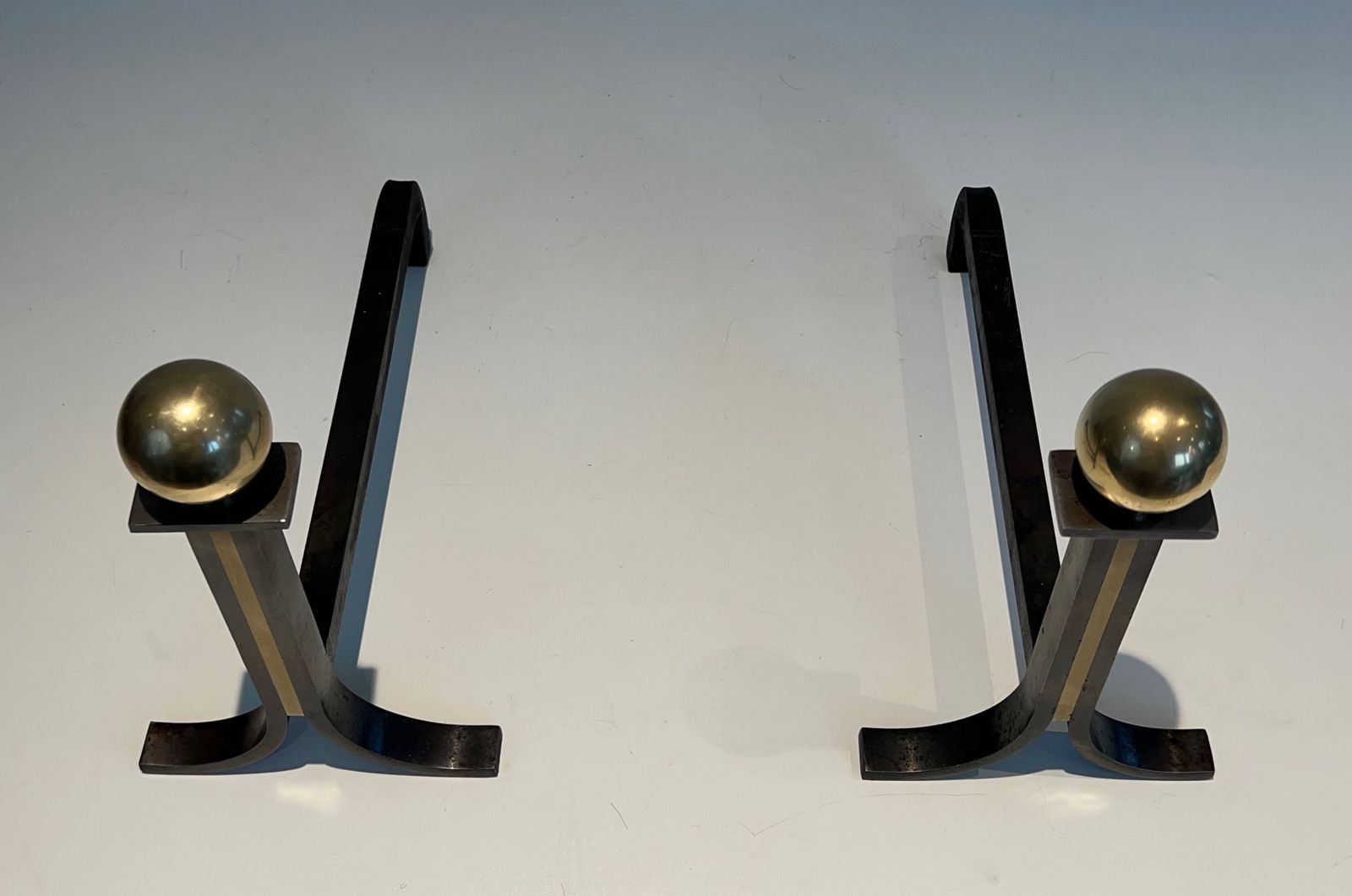 Pair Of Modernist Andirons In Steel, Brass And Wrought Iron In The Style Of Jacques Adnet photo Home Fixtures