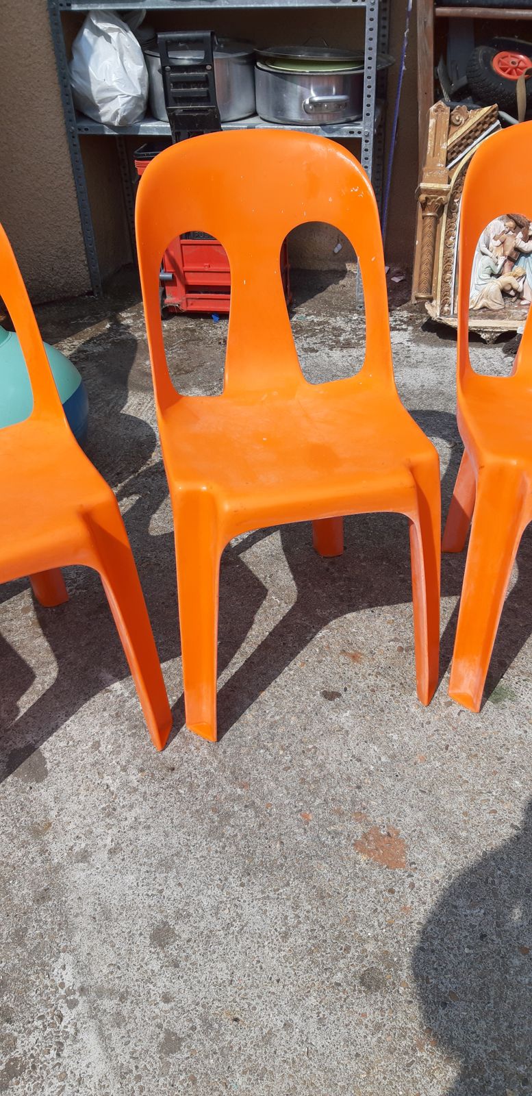 12 Stackable Orange Plastic Chairs photo vintage