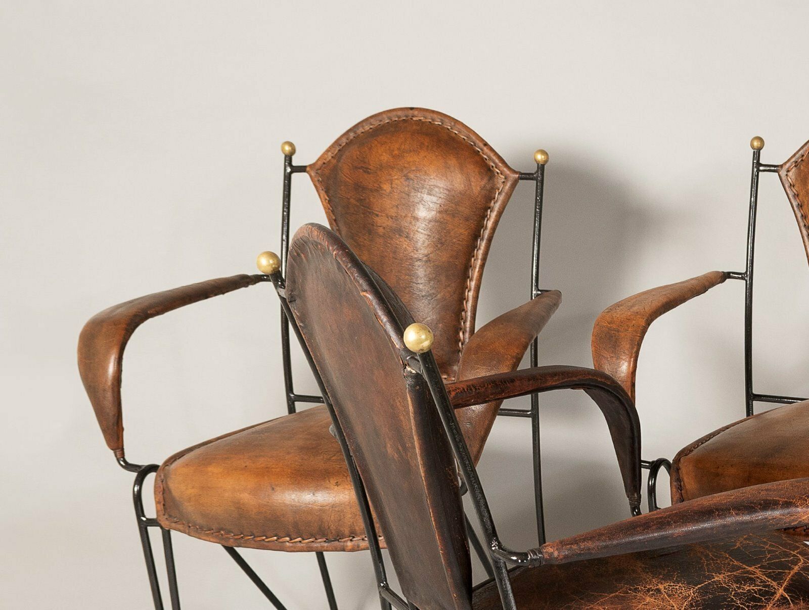 photo furniture Set Of 4 1950s French Jacques Adnet Iron Frame With Stitched Leather Armchairs