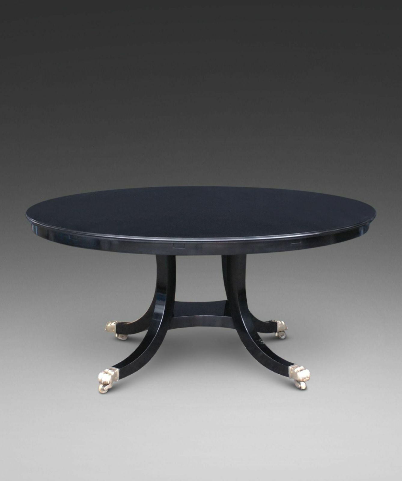A Superb Ebonised "Jupe" Style Dining Table. photo furniture
