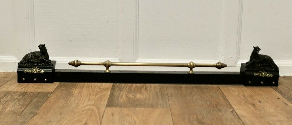 A Brass And Iron Country House Fender With Mountain Goats