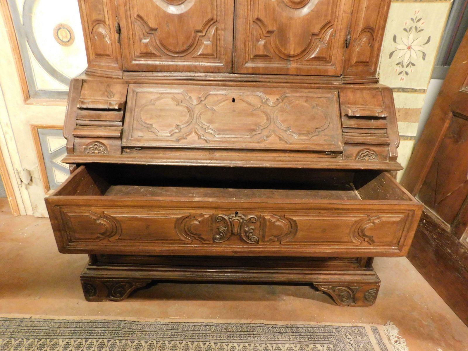 photo furniture Trumeau, Double Body In Carved Walnut With Doors, Flap And Drawers, Italy
