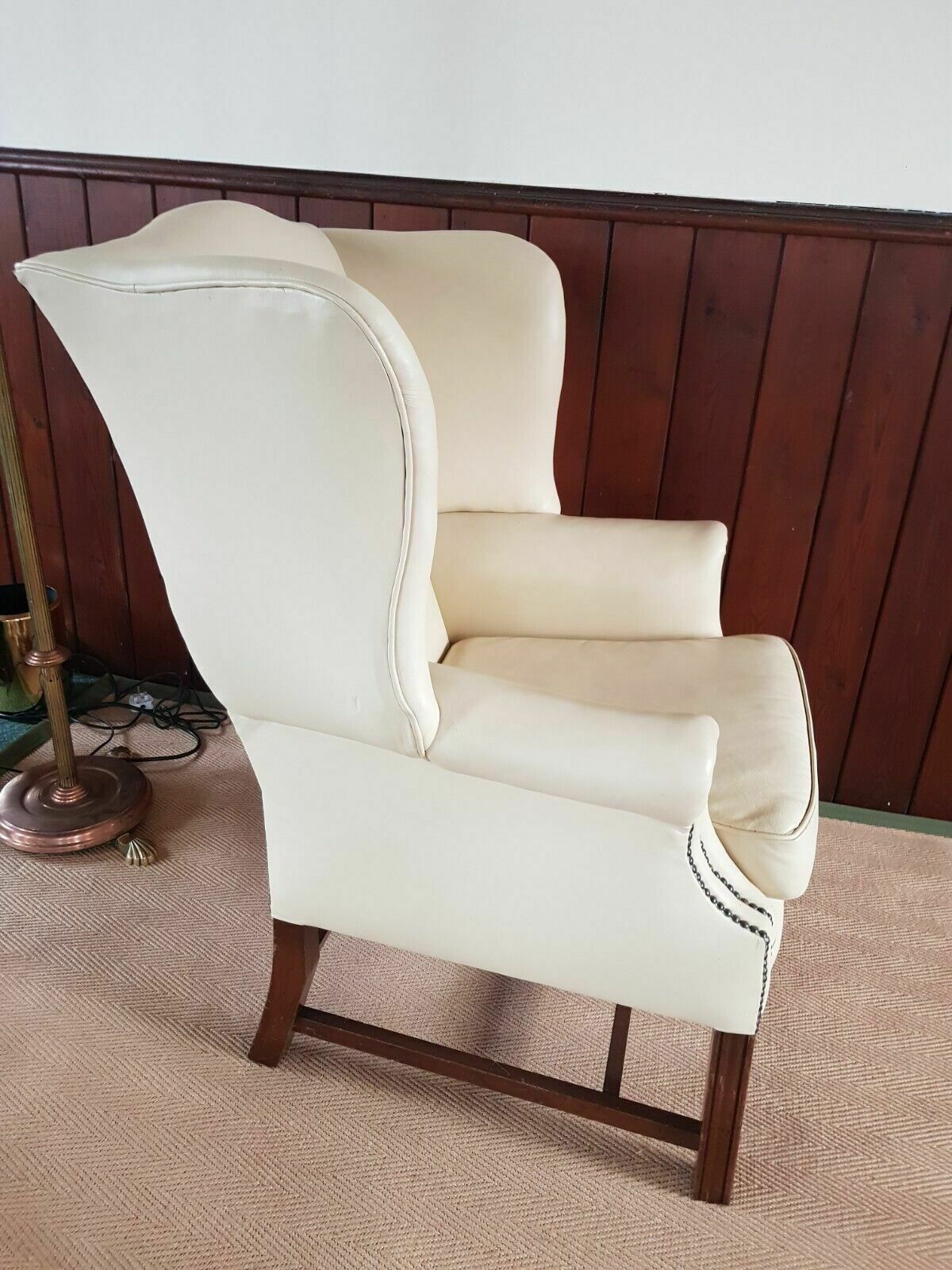 A Reupholstered Leather George III Style Wingback Armchair photo buy