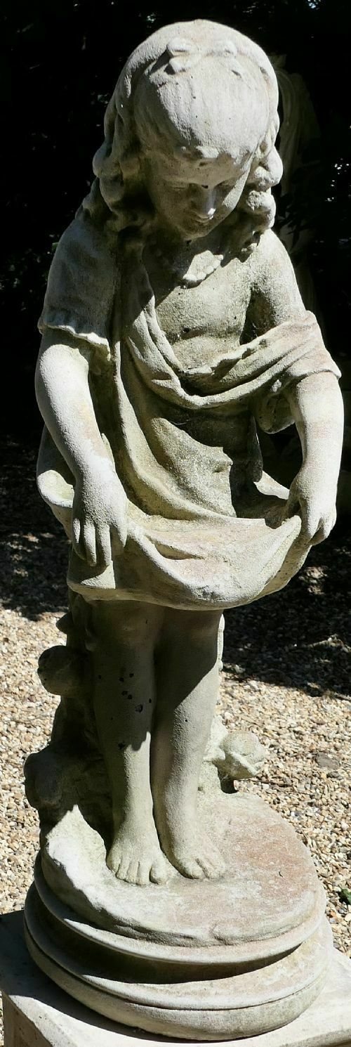 Statue Of A Girl Holding Out Her Apron photo for sale