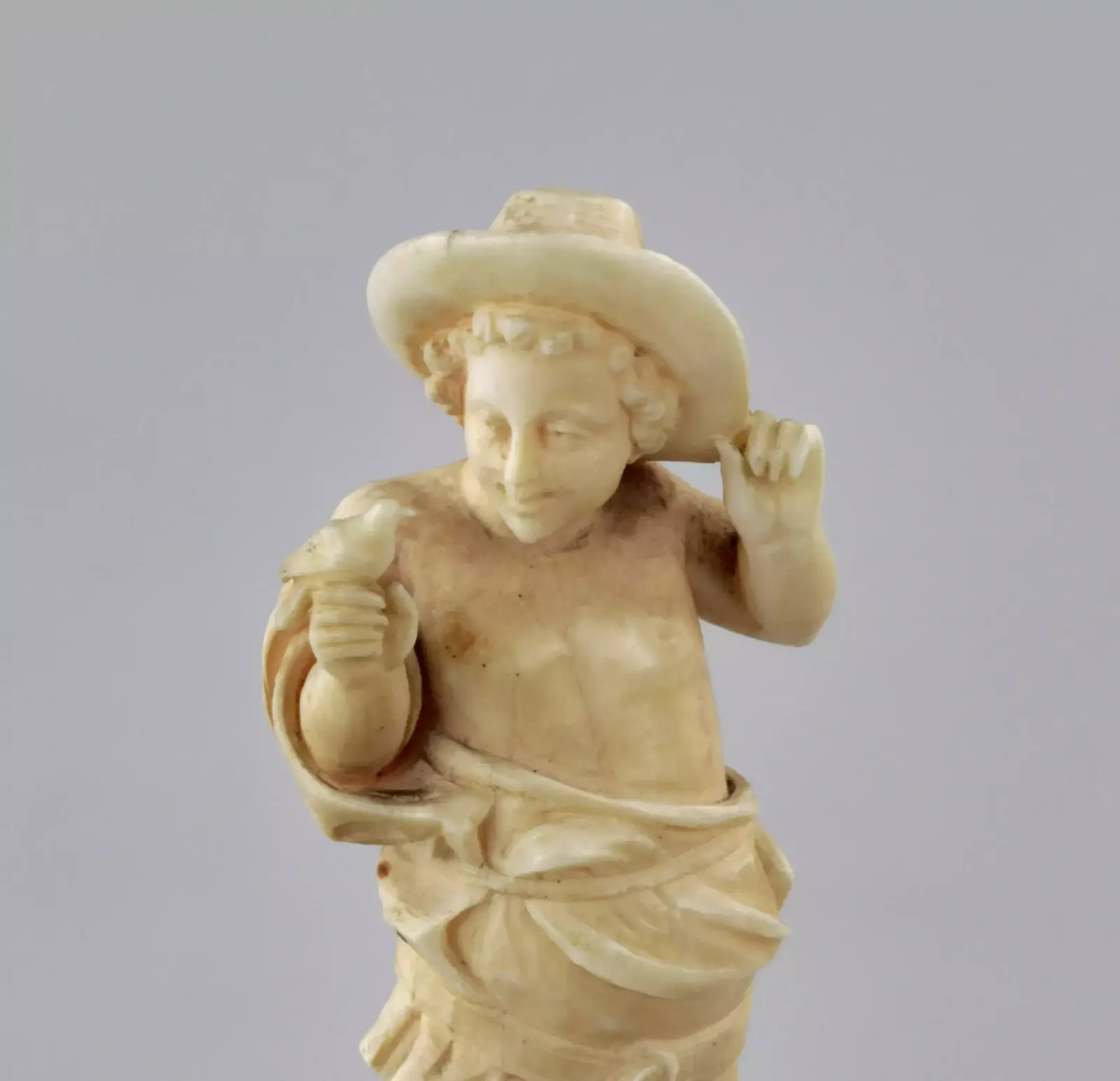Carved Ivory Figurine Of A Boy With A Bird 1800s. photo for sale