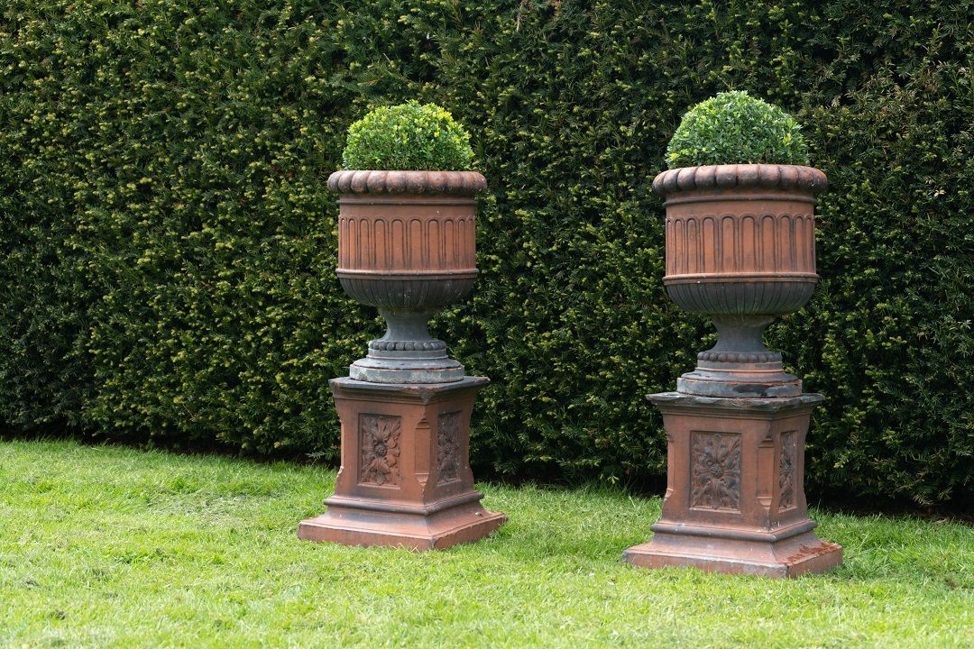Pair Of Antique Terracotta Urns On Plinths