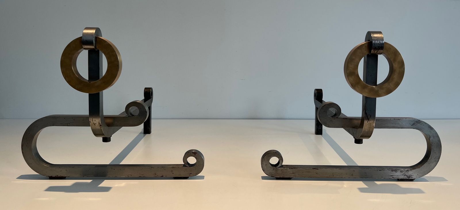 photo furniture Pair Of Modernist Andirons In Chromed Steel, Brass And Wrought Iron