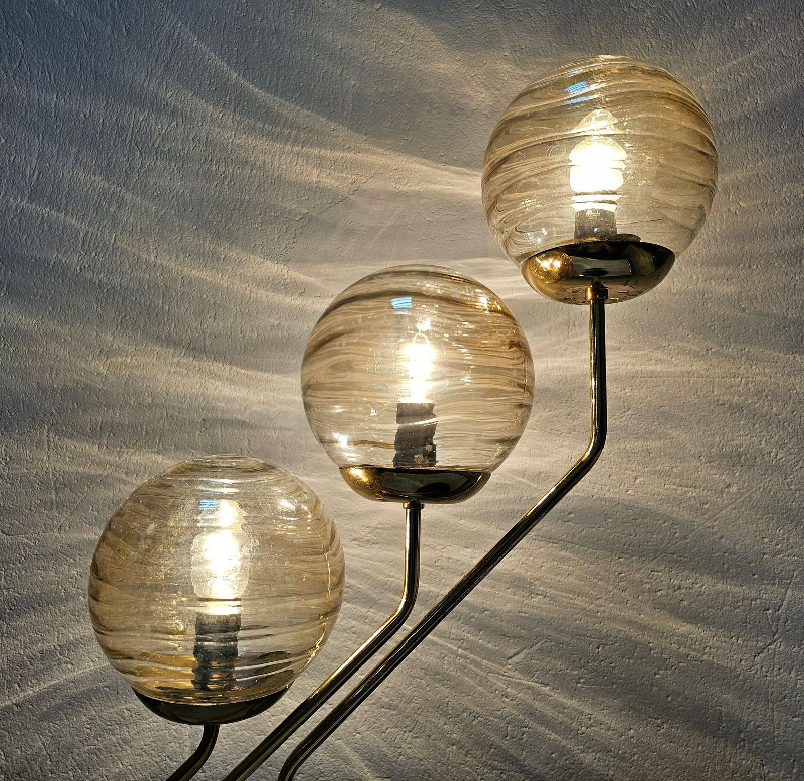photo for sale Mid Century Modern 3 Arm Table Lamp In Black And Gold With Texture Glass Ball Shades Made In Yugoslavia In 1960s