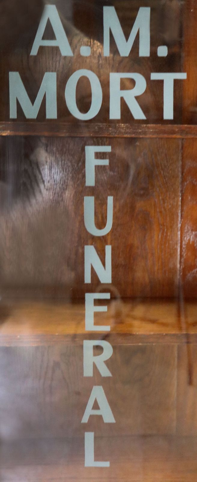 A Lovely Art Deco Styled Cabinet Sign Written With The Details Of A Funeral Directors. photo vintage
