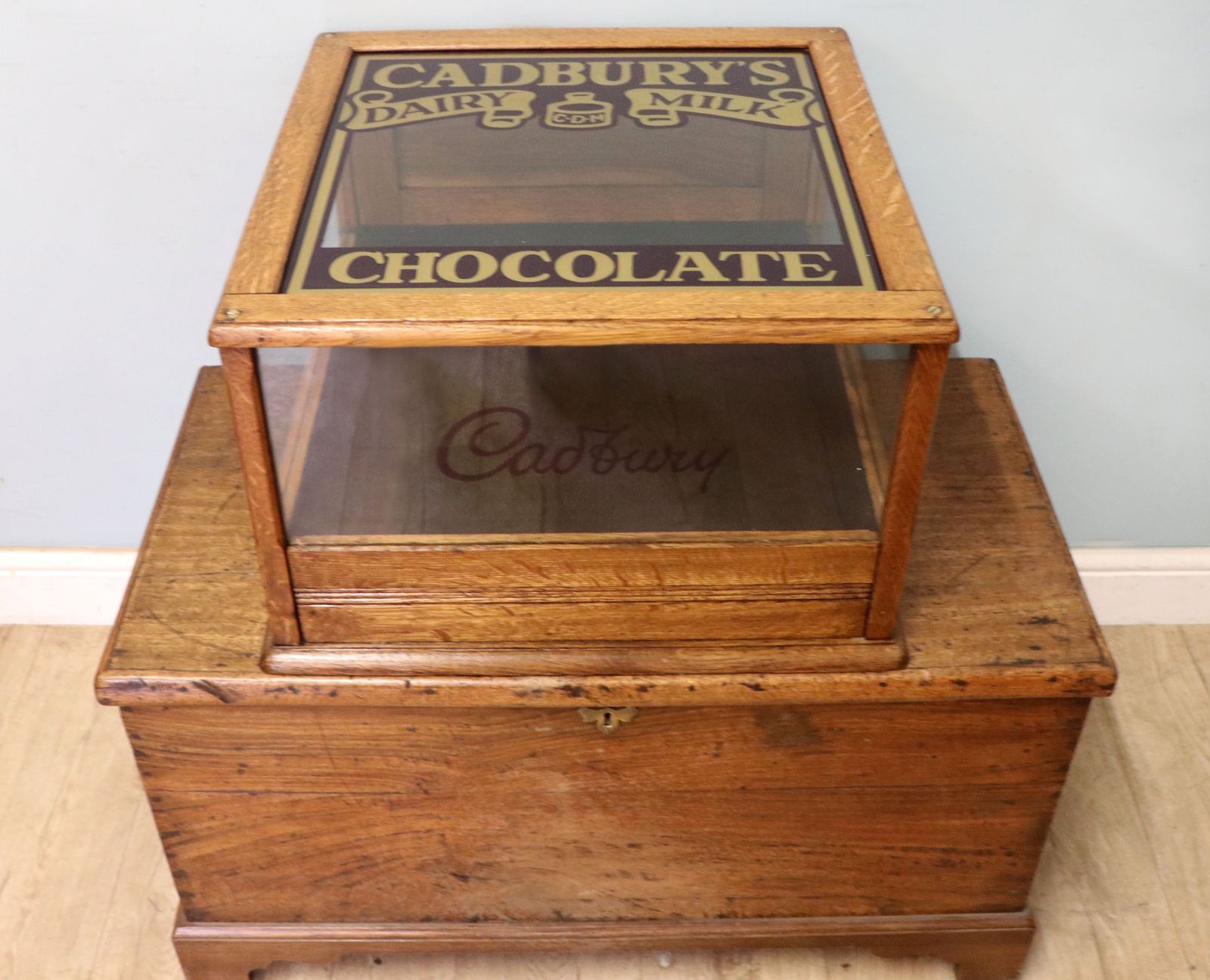 A Lovely Early 20th Century Oak Countertop Display Cabinet, Later Sign Written For Cadburys Chocolate. photo Furniture