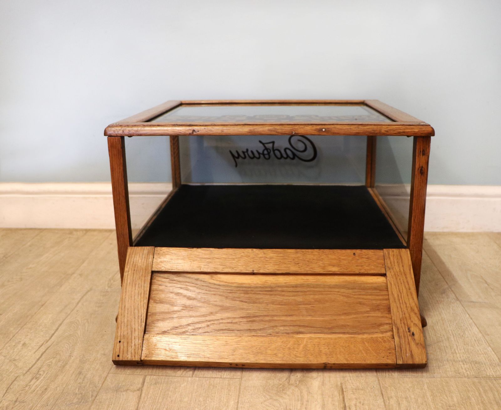 995.0 A Lovely Early 20th Century Oak Countertop Display Cabinet, Later Sign Written For Cadburys Chocolate. photo