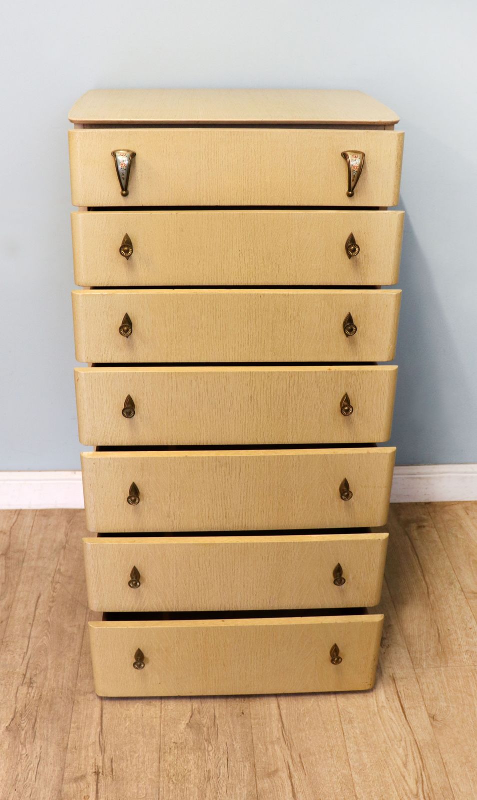 A Lovely Mid Century Blond Oak Veneered Chest Of Seven Drawers. photo furniture