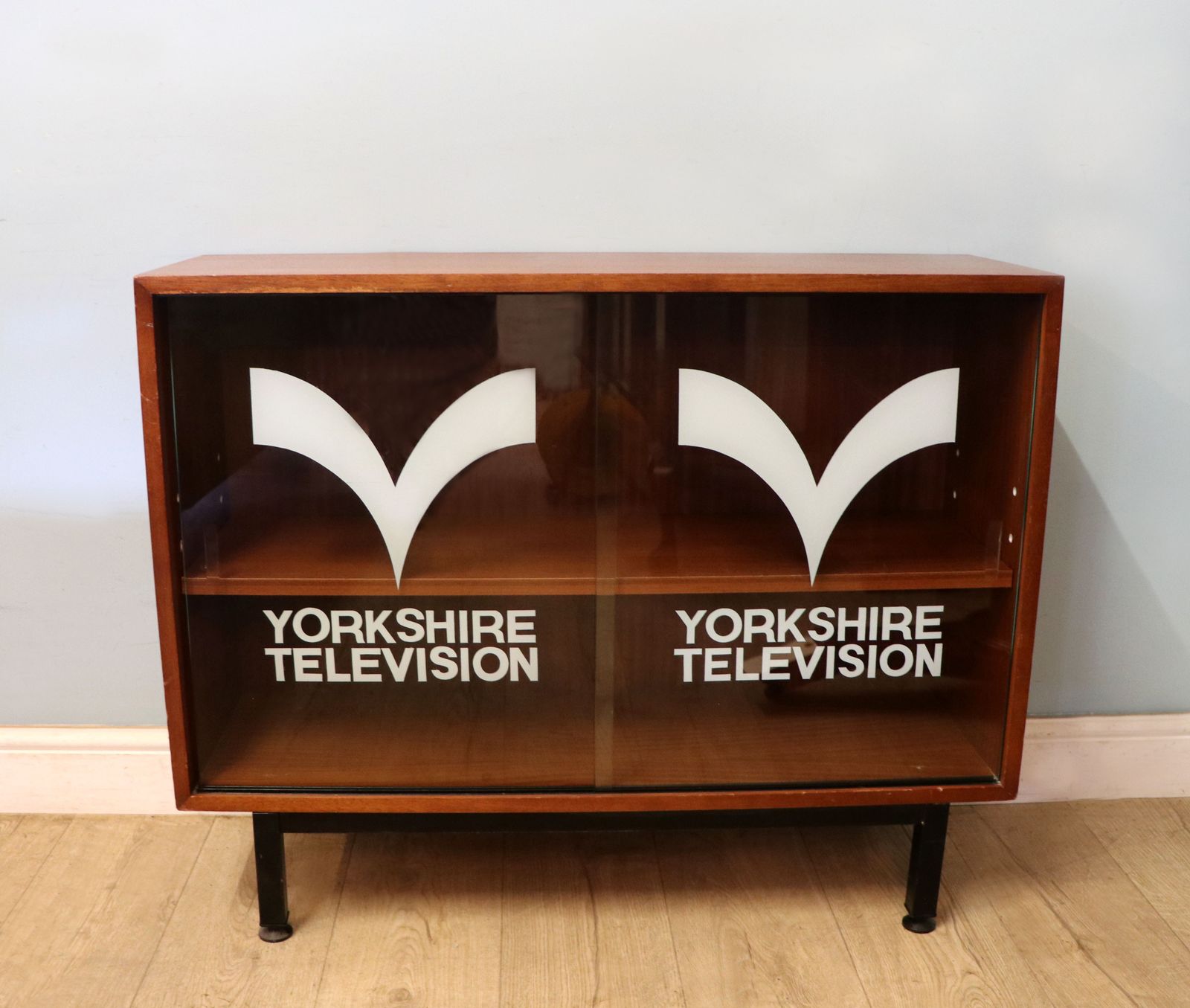 This Lovely Retro Teak Finish Display Cabinet Later Sign Written For Yorkshire Television.