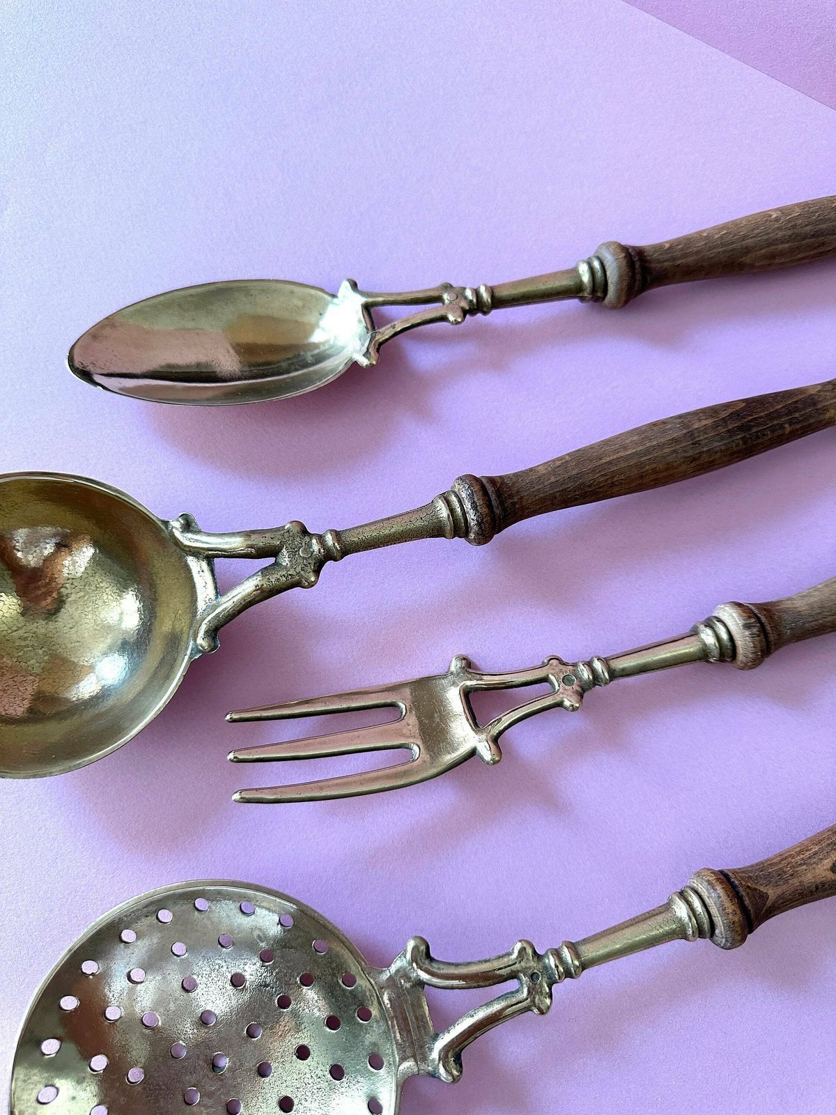 photo furniture Vintage Brass Utensils Set. Wall Mounted Antique Cooking Utensils With Wooden Handles.