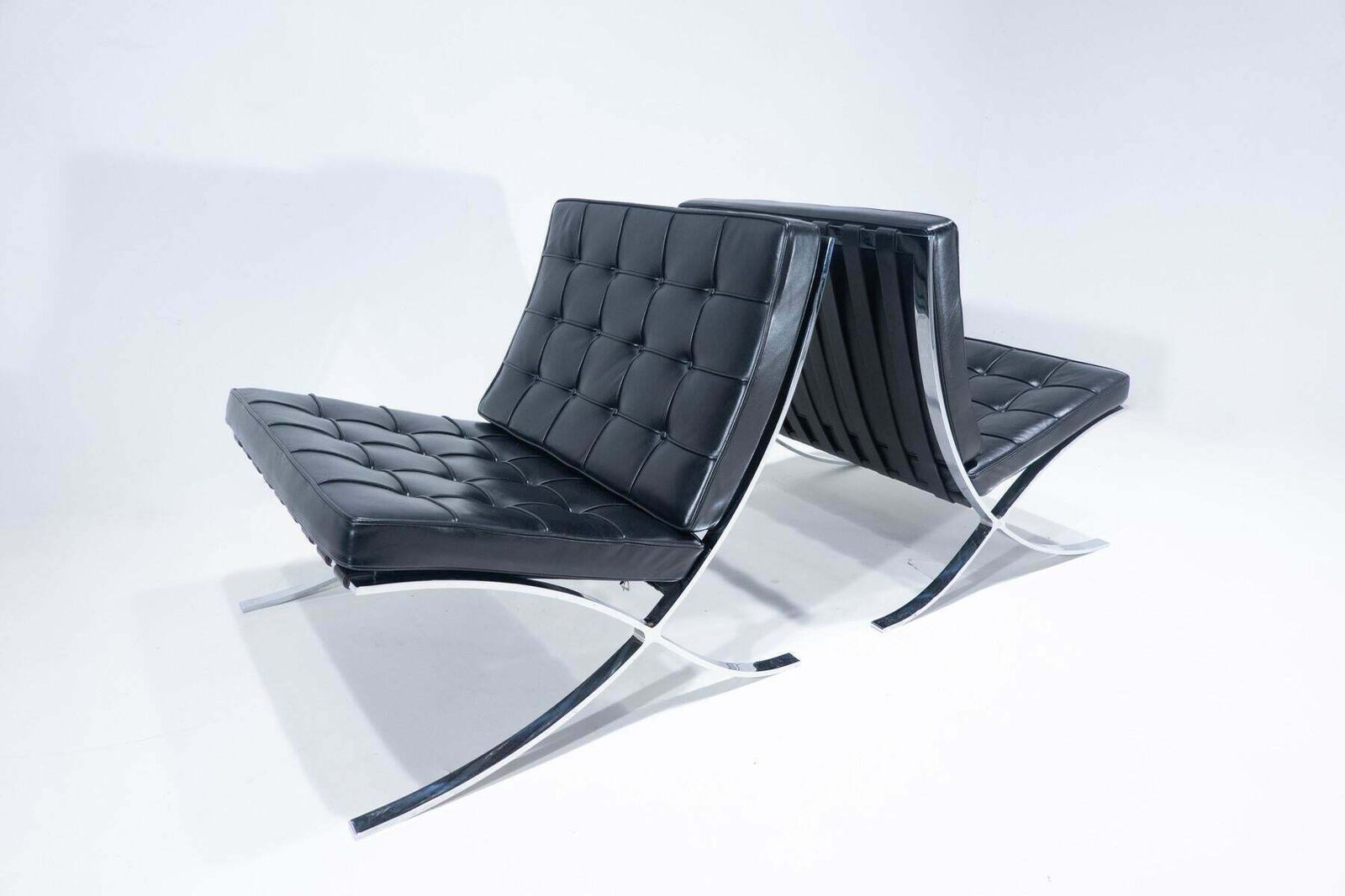 photo furniture Pair Of Black Leather Barcelona Chairs By Mies Van Der Rohe For Knoll, 1960s