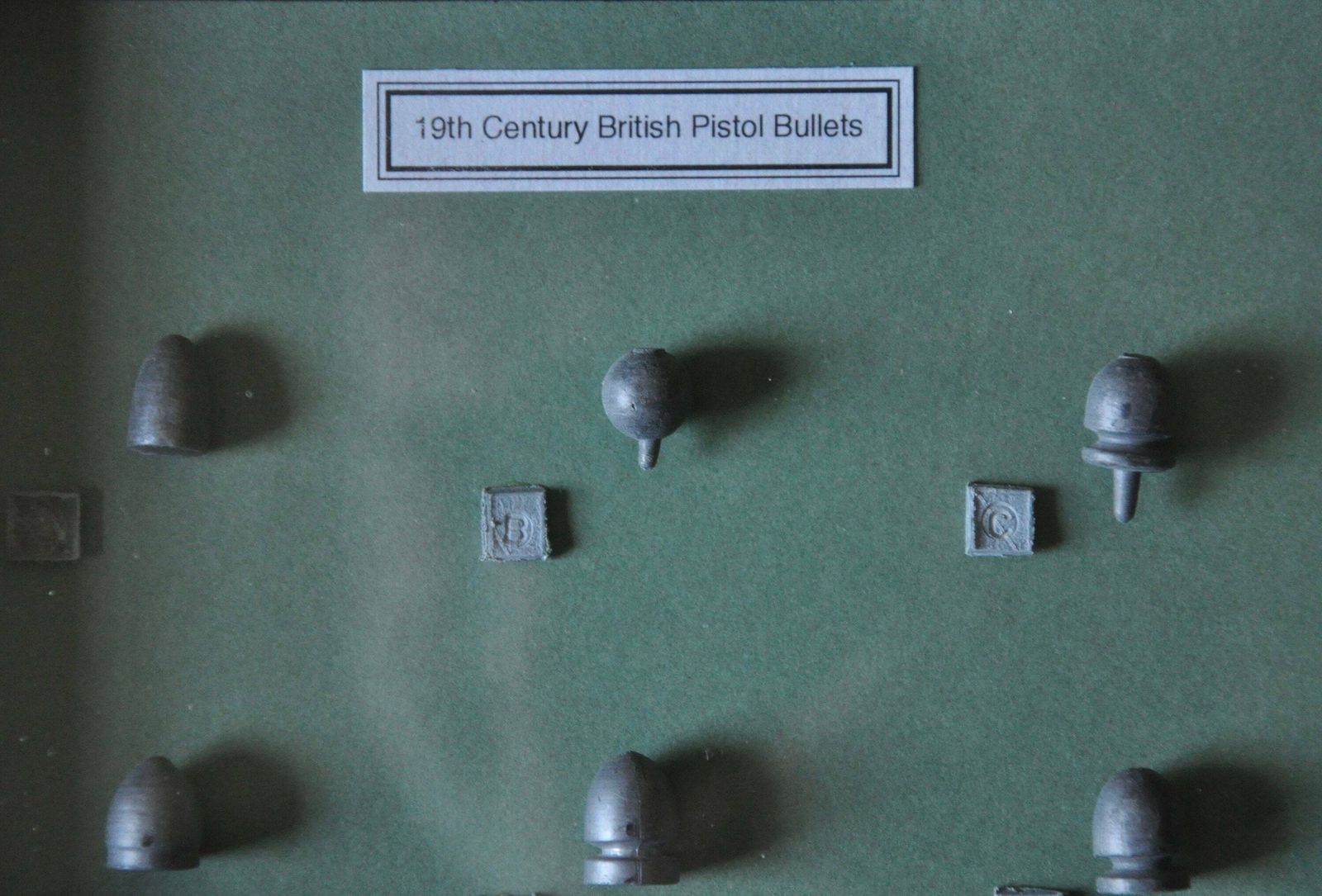 19th Century British Pistol Cast Lead Bullets In Display Frame photo furniture