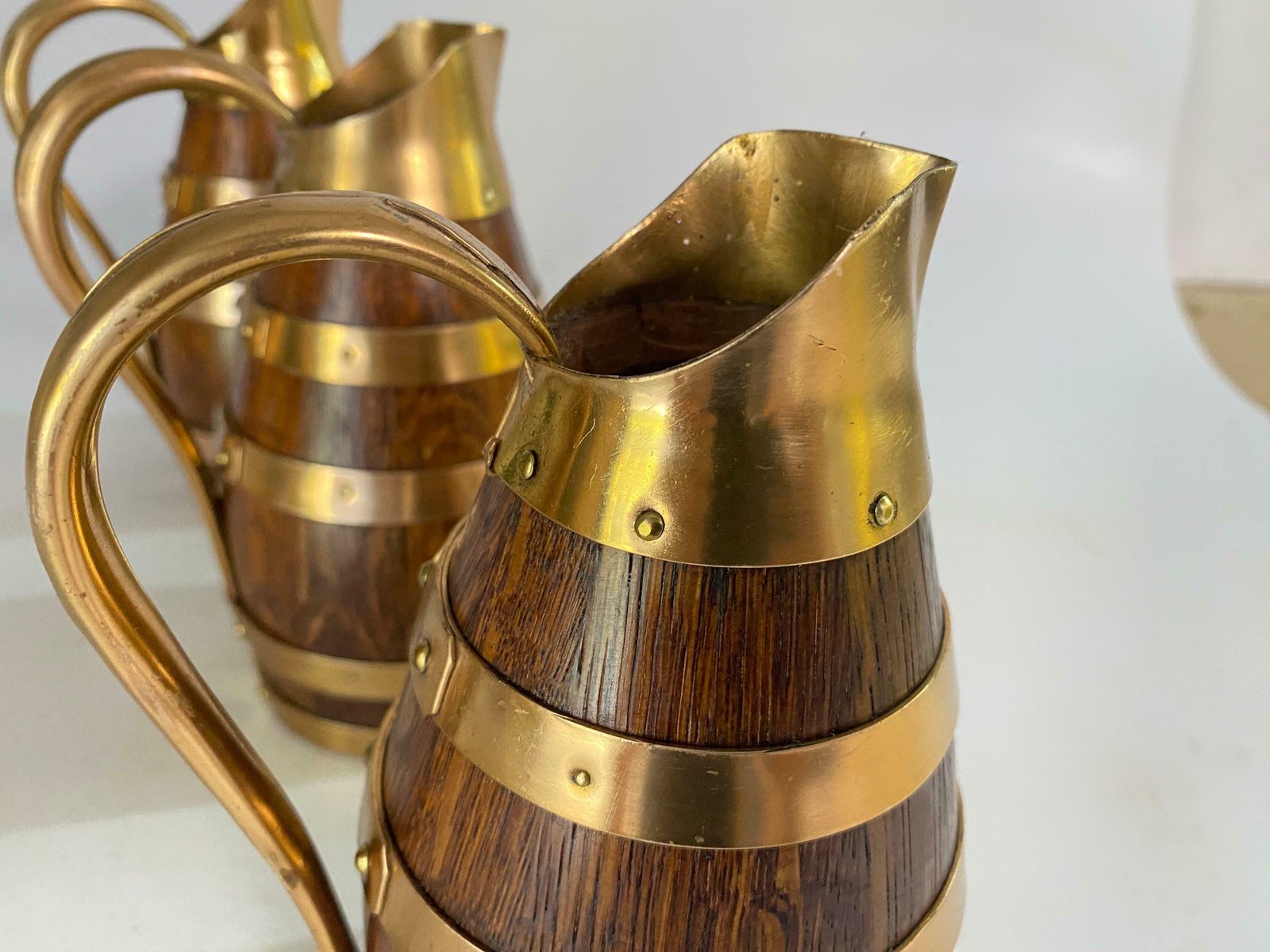 photo furniture Gerard Lafitte Oak And Brass Barrel Form Pitcher Wooden Jug France 1933 Set Of 3