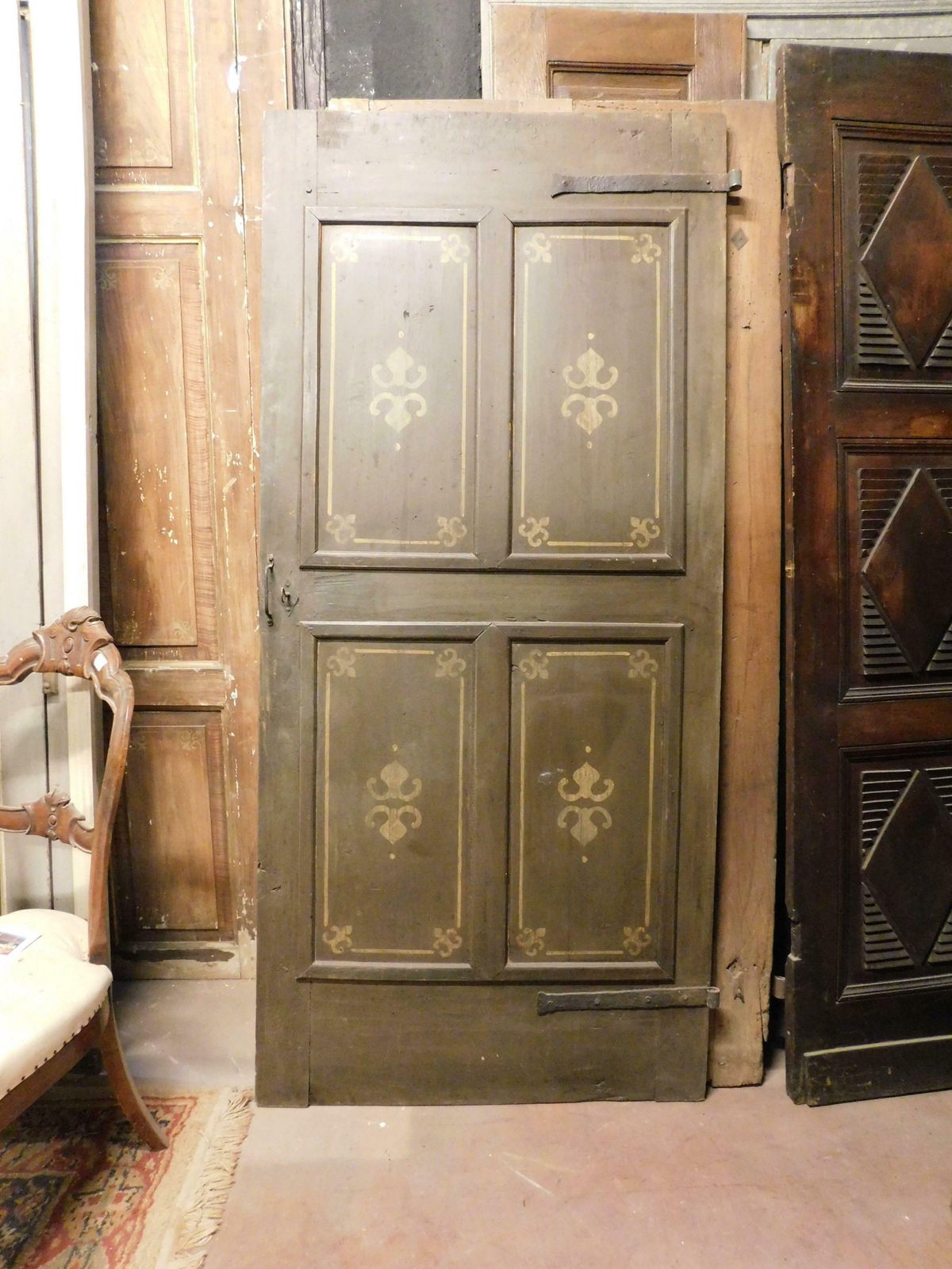 Old Door With 4 Painted Panels, Yellow Decorations On Green Background, Italy photo buy