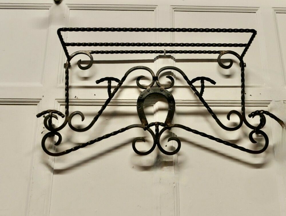 French Wrought Iron Wall Hanging Rack For Coats And Tack On A Horse Riding Theme photo furniture