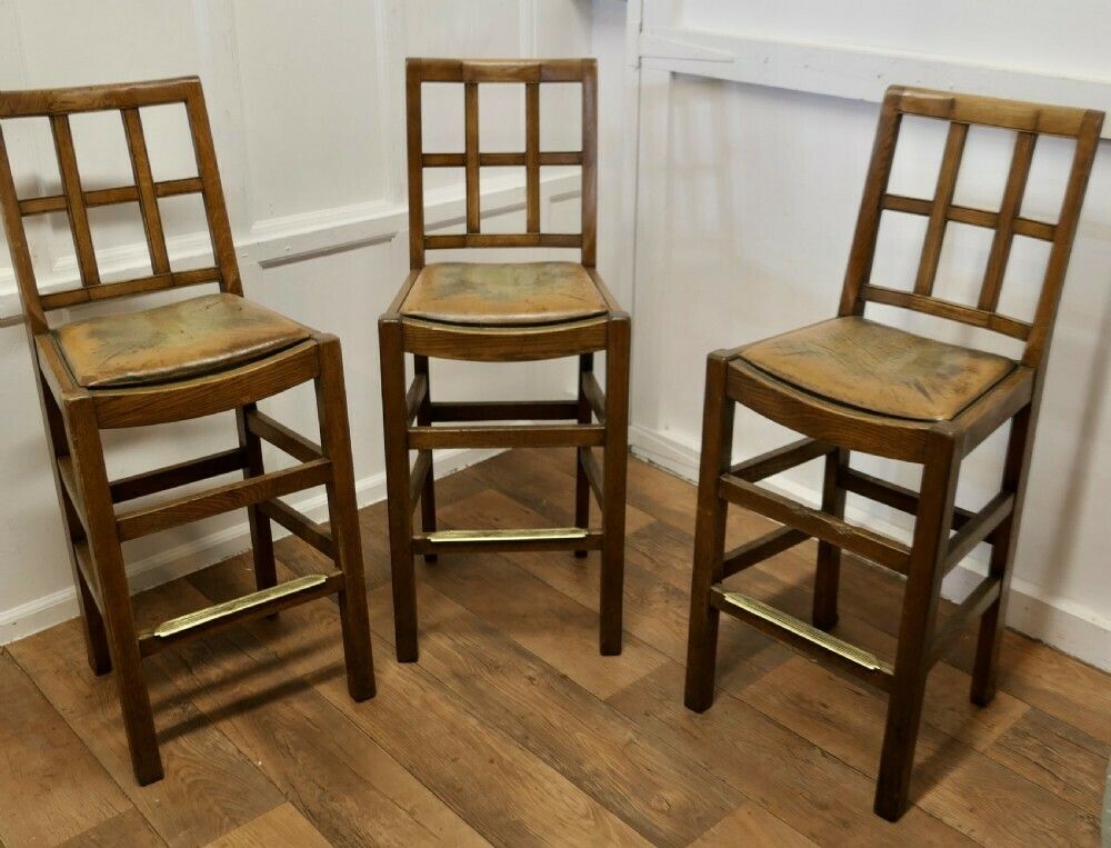 photo furniture A Rare Trio Of Arts And Crafts High Bar Stools, In Golden Oak