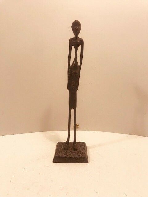 A Metal Statuette Of An African Woman In The Style Of Alberto Giacometti