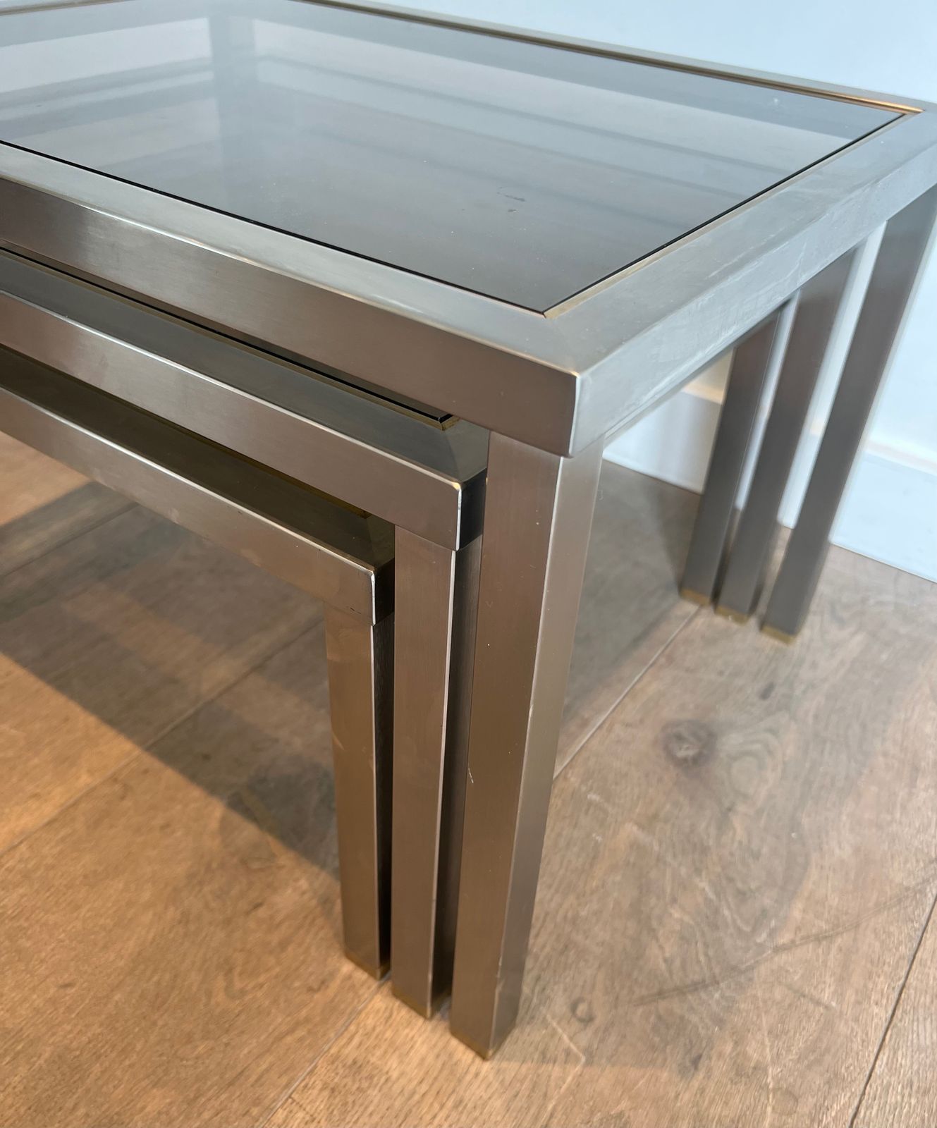 photo buy Suite Of 3 Nesting Tables In Brushed Steel And Brass Attributed To Guy Lefèvre