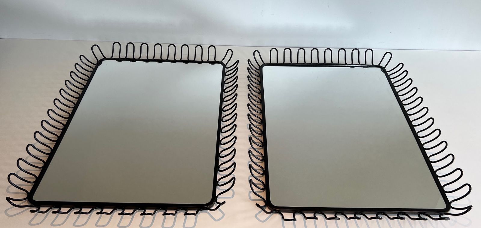 photo vinterior Pair Of Mirrors In Black Lacquered Metal In The Taste Of Jean Royère. Around 1980
