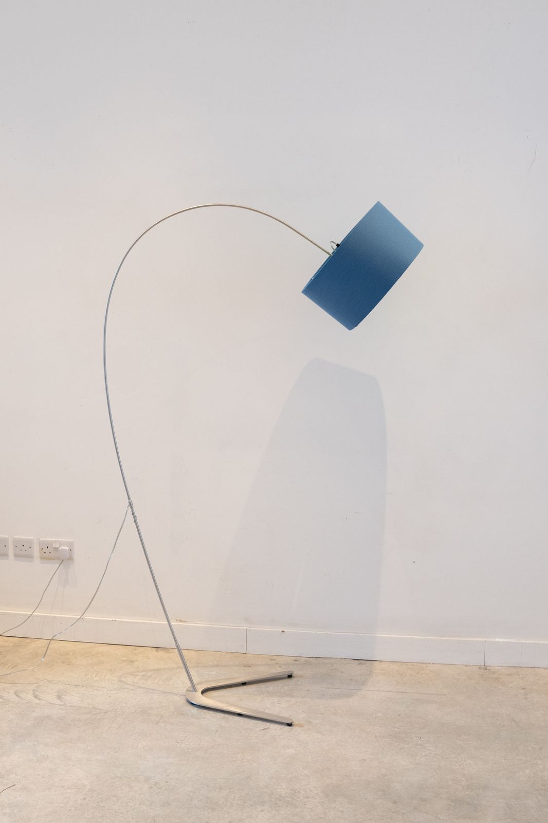 Standard Lamp With Blue Shade With Green Interior Over Arched Shaft To A U Shape