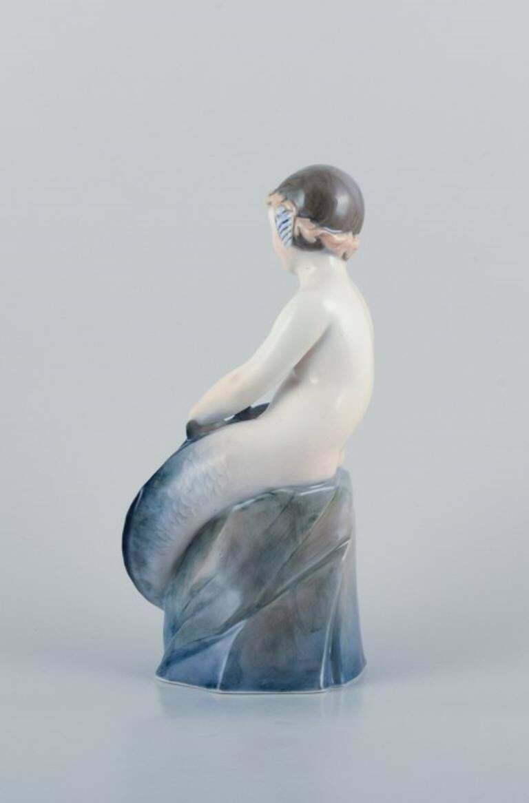 Royal Copenhagen, Rare Porcelain Figurine Of A Mermaid With Fish In Her Hands photo for sale