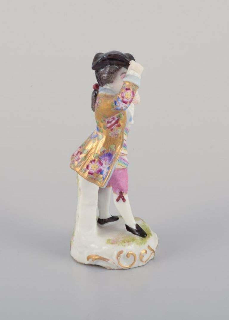 Meissen, Germany. Porcelain Figurine Of Young Man In Elegant Attire. photo 565.0