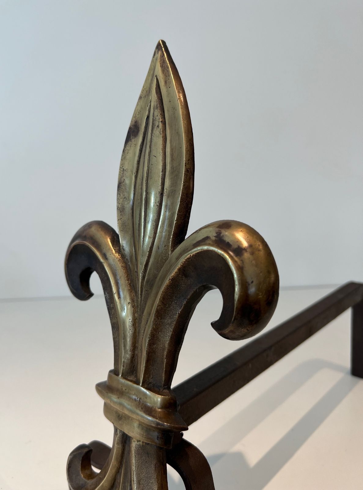 Pair Of Bronze And Wrought Iron Andirons Representing A Fleurs De Lys photo vintage