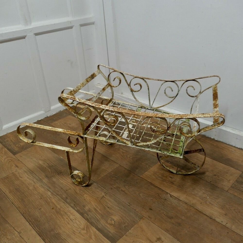 Wrought Iron Hand Cart Wheel Barrow For Plant Display photo vinterior