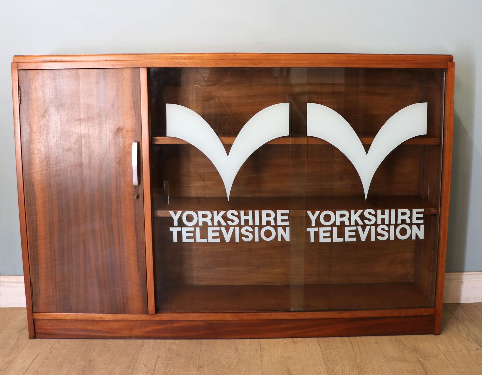 A  Mid Century Retro Style Display Cabinet By Cresta, Sign Written Yorkshire Television.