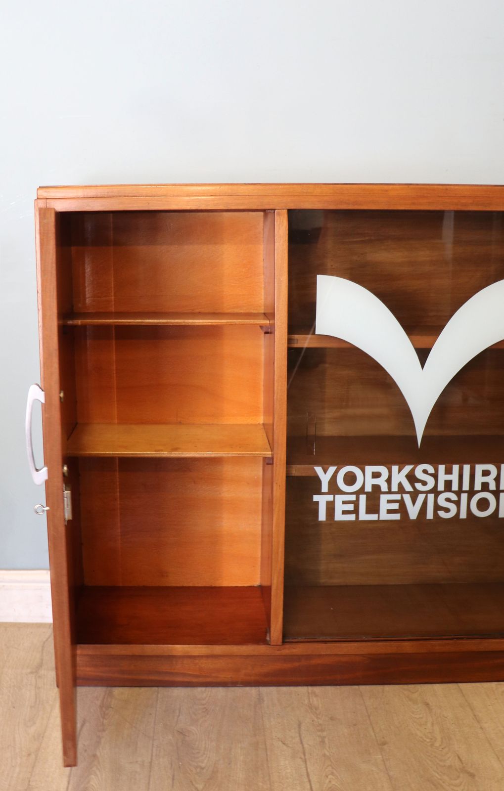 A  Mid Century Retro Style Display Cabinet By Cresta, Sign Written Yorkshire Television. photo vintage