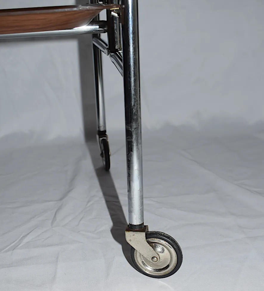 A Mid Century Bremshey & Co German Dinette Trolley. Made Of Chrome & Lamented Wood. It Folds Into A Smaller Frame. Attribution Mark On The Wheels. photo vinterior