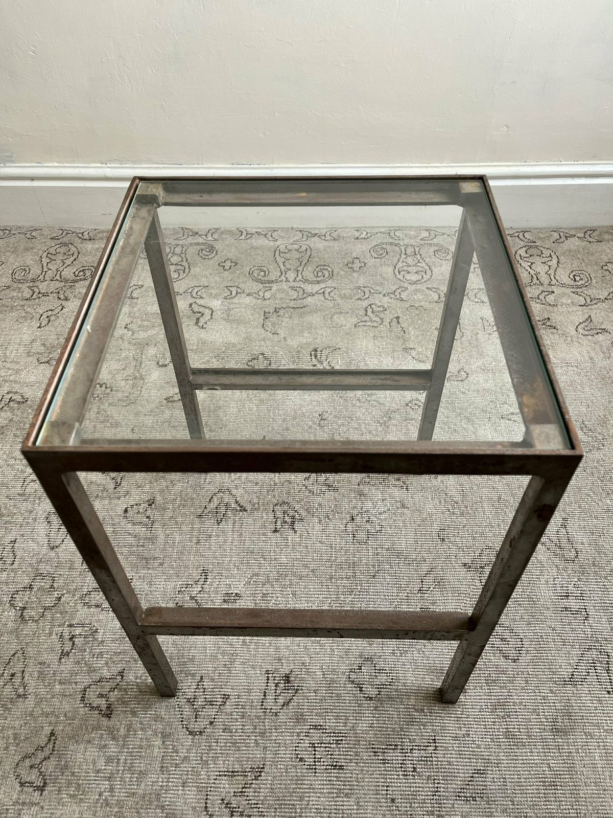 photo furniture Patinated Metal End Table Of Industrial Design, Bespoke Piece With Glass Top