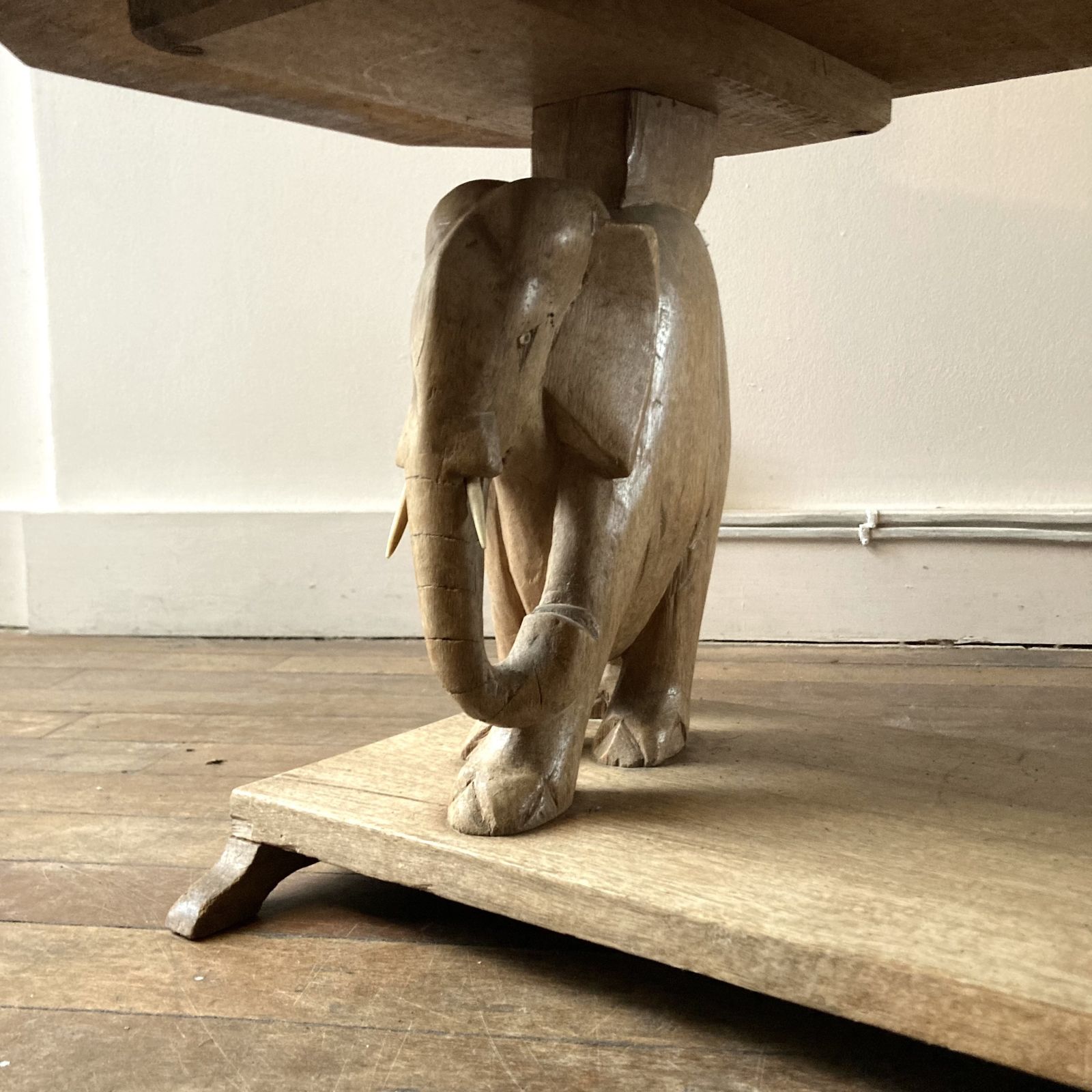 An Exotic Hardwood Low Table With Two Elephant Supports, One Minus A Tusk. 1950s photo for sale