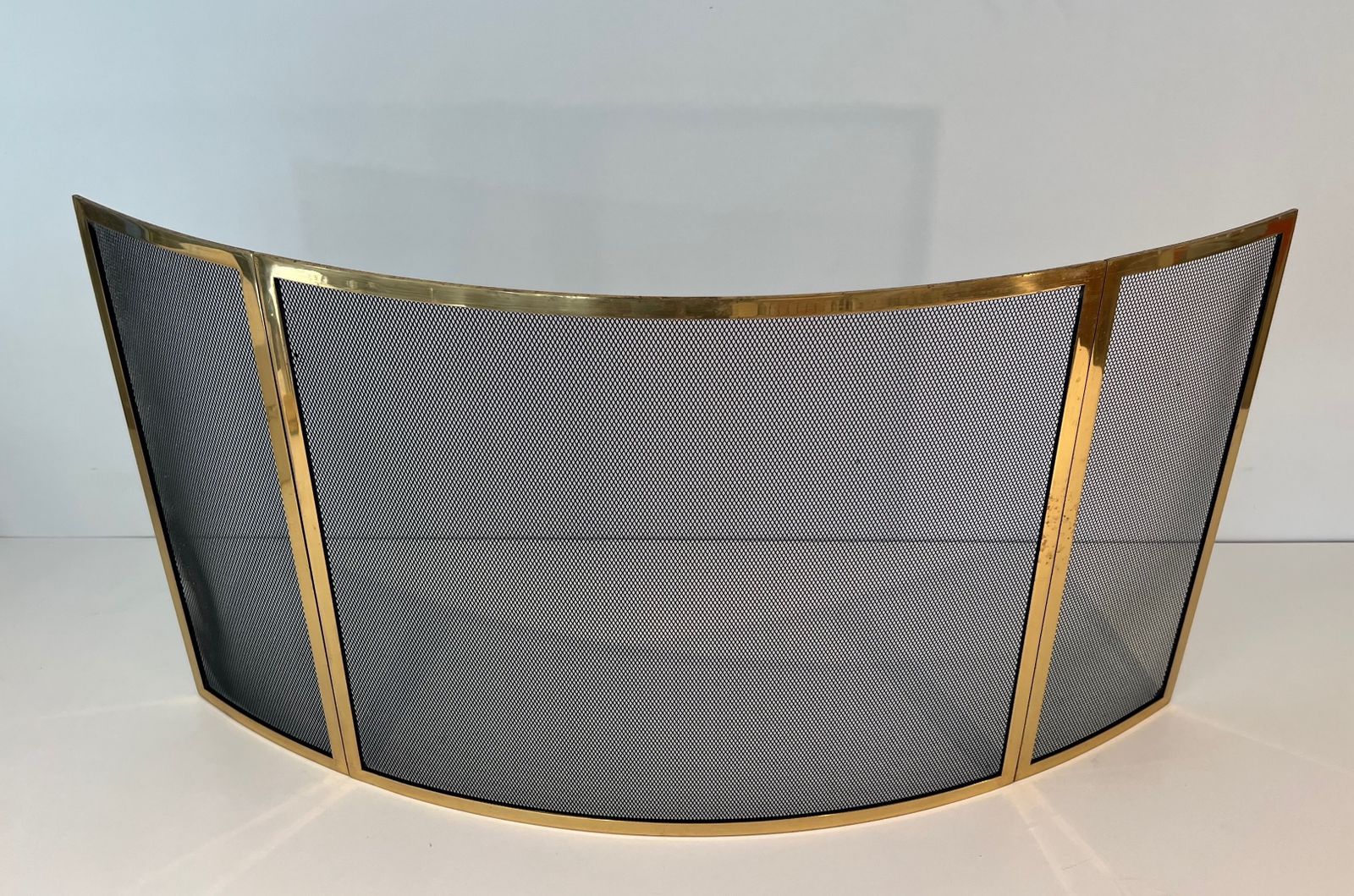 Curved Brass Firewall And Wire Mesh photo furniture